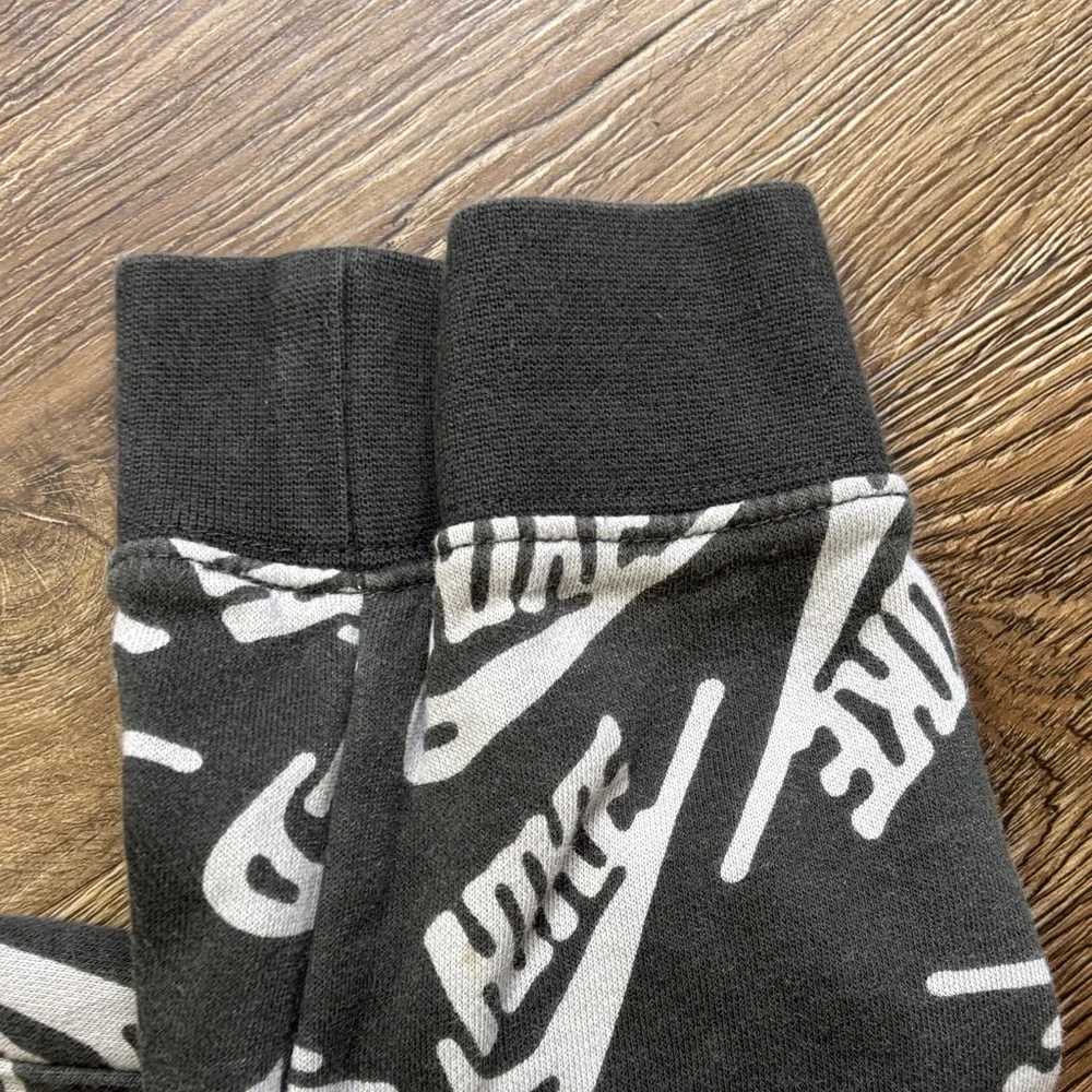Nike Club Black Jogger Pants with White Logo Print and Neon Green Drawstring